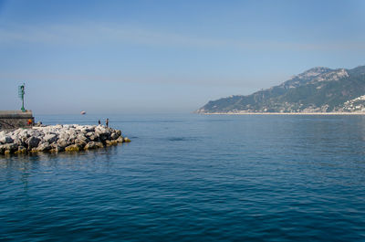 Scenic view of sea against clear blue sky