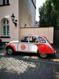 Car on street against building