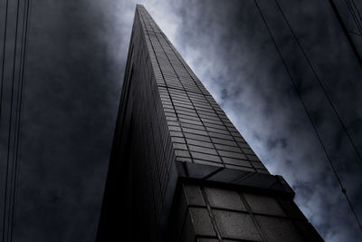 Low angle view of skyscraper against sky