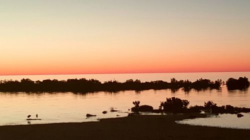 Scenic view of sunset over river