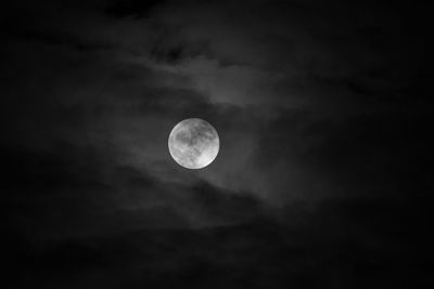 Low angle view of moon against sky at night