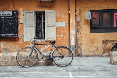 Bicycles on street against building