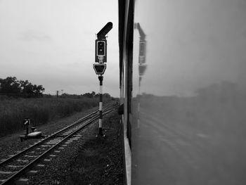 Train on railroad track against sky