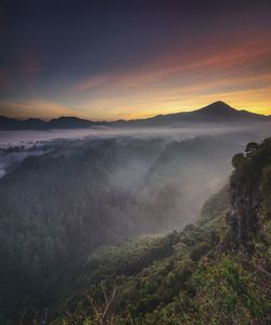 Scenic view of mountains against sky during sunset