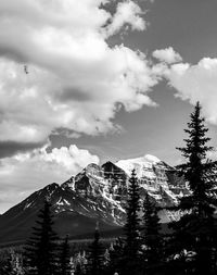 Scenic view of mountains against cloudy sky