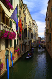 Canal amidst buildings in city