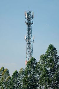 Low angle view of communications tower against sky