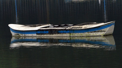 Boat moored in lake