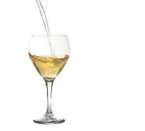 Close-up of wine in glass against white background