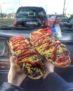 Cropped image of man holding cigarette