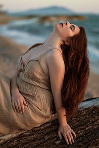 Midsection of woman at beach