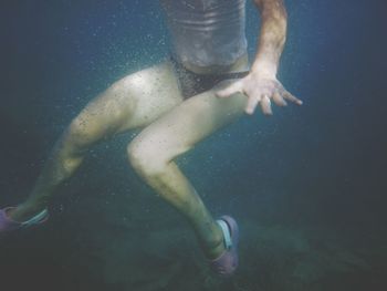 Woman legs in water at night