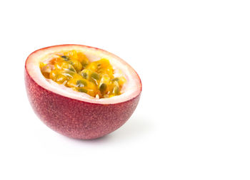 Close-up of fruit slices over white background