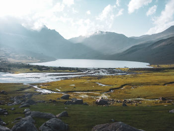 A beautiful lake surrounded by the indian himalayas and floating cloud, 