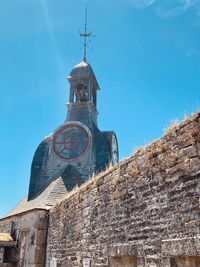 Low angle view of clock tower against sky