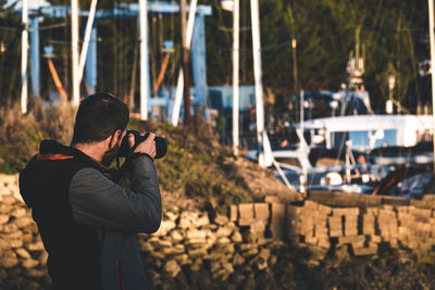 Man photographing boats