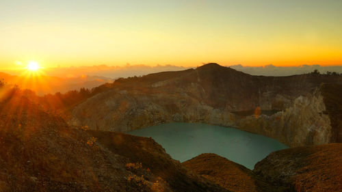 Scenic view of landscape against sky during sunset