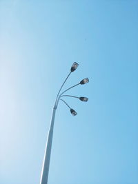 Low angle view of street light against clear sky