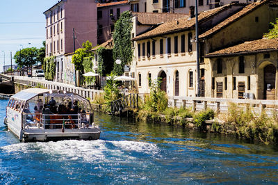 View of an old canal with boat in front of building