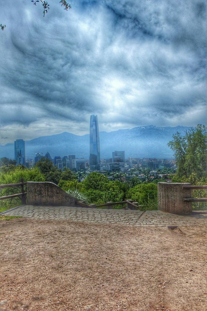 sky, cloud - sky, architecture, built structure, cloudy, building exterior, cloud, city, overcast, weather, storm cloud, tree, day, landscape, field, cityscape, no people, building, outdoors, tower