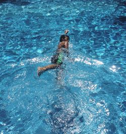 Woman jumping in sea