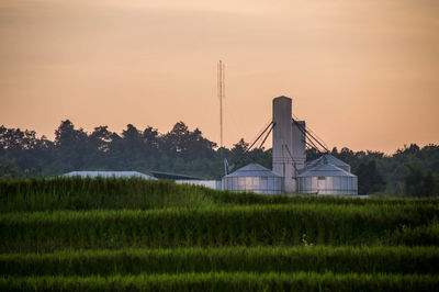 Scenic view of field against sky during sunset