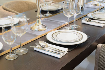 High angle view of glasses on table in restaurant