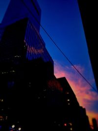 Low angle view of modern buildings against sky