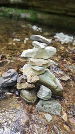 Close-up of rock on lake