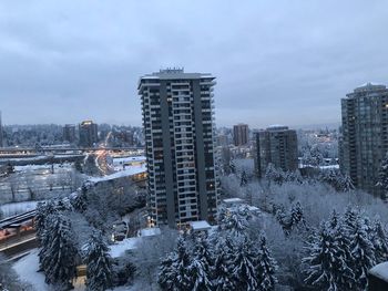 High angle view of snow covered buildings against sky