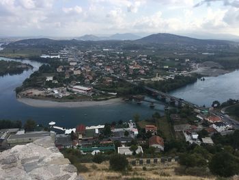High angle view of river amidst buildings in town