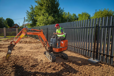 Rear view of man working at construction site