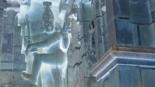 Close-up of statue against temple