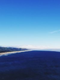 Scenic view of sea against blue sky