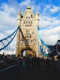 Bridge against cloudy sky