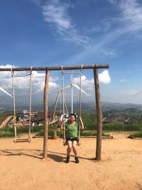 Full length of woman on swing