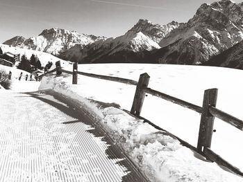 Scenic view of snow covered mountains against sky