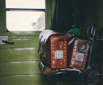 Close-up of leather bags in train