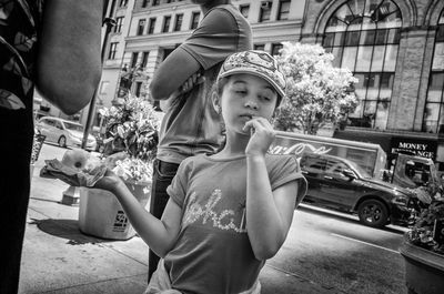 Portrait of happy girl in city