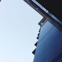 Low angle view of skyscraper against clear sky