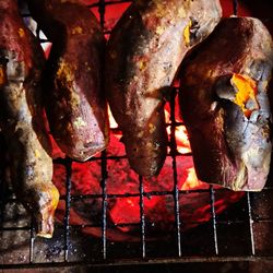 Close-up of meat on barbecue grill