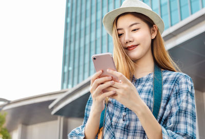 Young woman using mobile phone