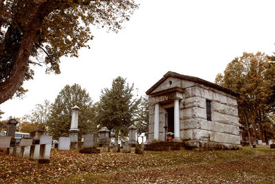 View of cemetery against buildings