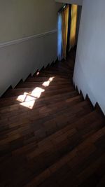 High angle view of sunlight falling on hardwood floor at home