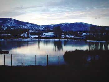 Scenic view of mountains against cloudy sky