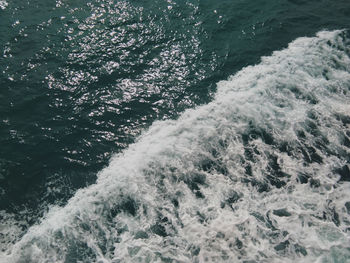 High angle view of water flowing in sea