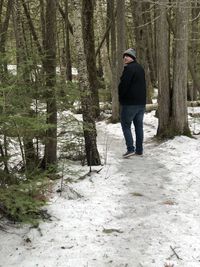 Full length of man walking in forest