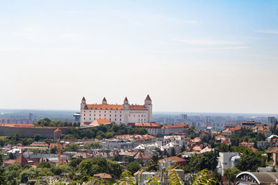 Buildings in city against sky