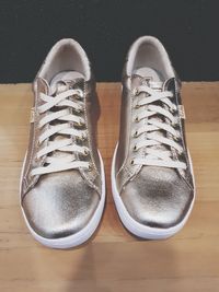 High angle view of shoes on hardwood floor