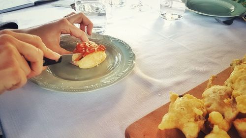 High angle view of woman holding food